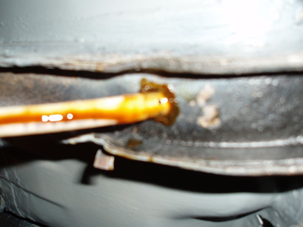 Spraying rustproofing into frame.JPG.jpg