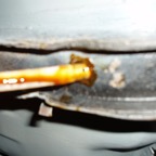 Spraying rustproofing into frame.JPG.jpg