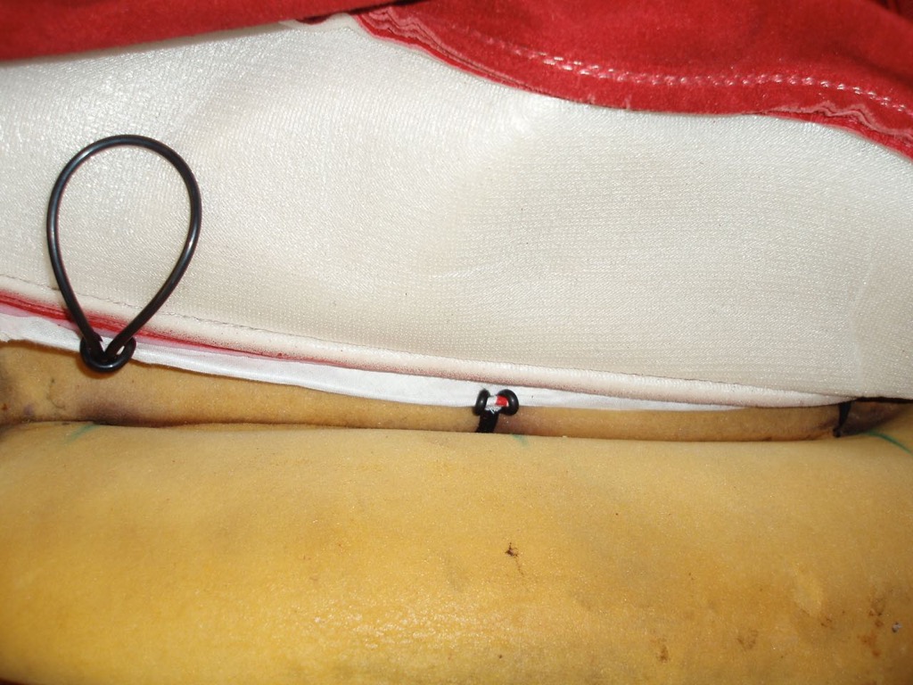 Moving around inserting bands through foam holes.jpg